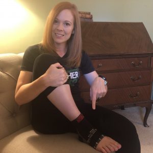 Gabe Cox points at her ankle injury that has been healing for six months