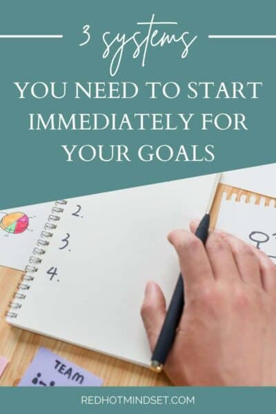 Notebook sitting on the table numbered one through four with a title 3 simple systems you need to start immediately for your goals