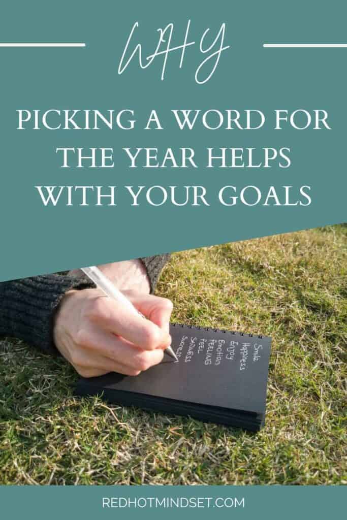 Pinterest graphic of someone in the grass writing in a journey with the title saying how picking a word for the year helps with your goals