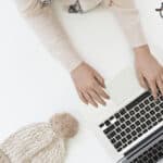 Woman sitting at a desk working on her laptop