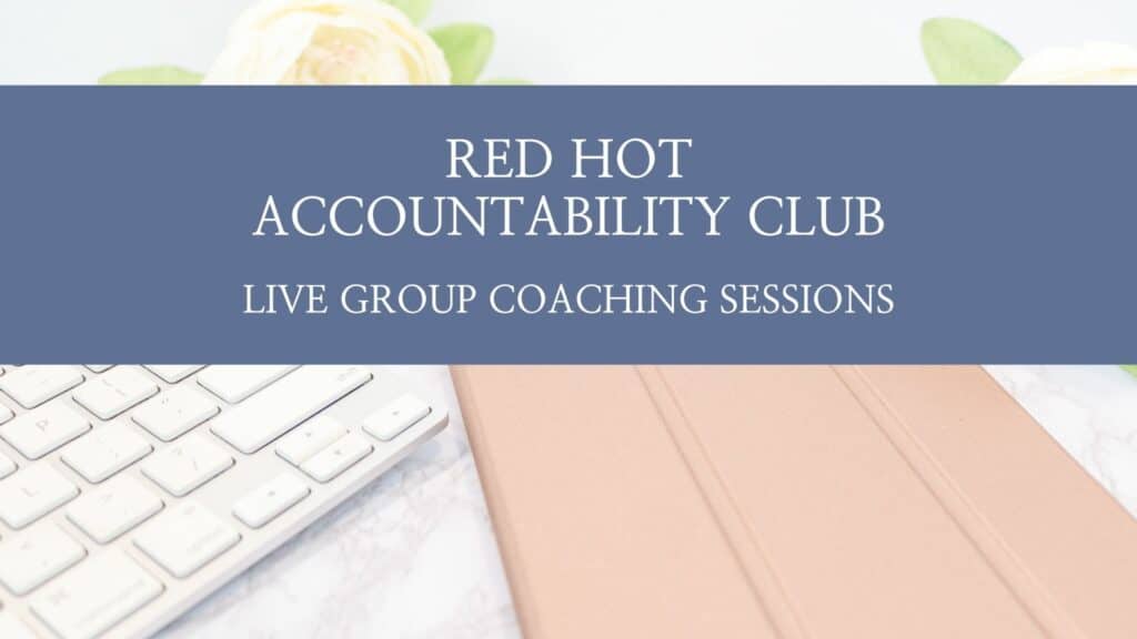 a white keyboard and rose gold journal sitting on a desk with a banner across saying Red Hot Accountability Club live group coaching sessions