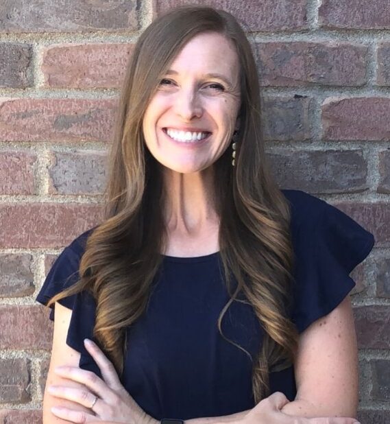 Headshot of Brittany Flammer, a financial coach